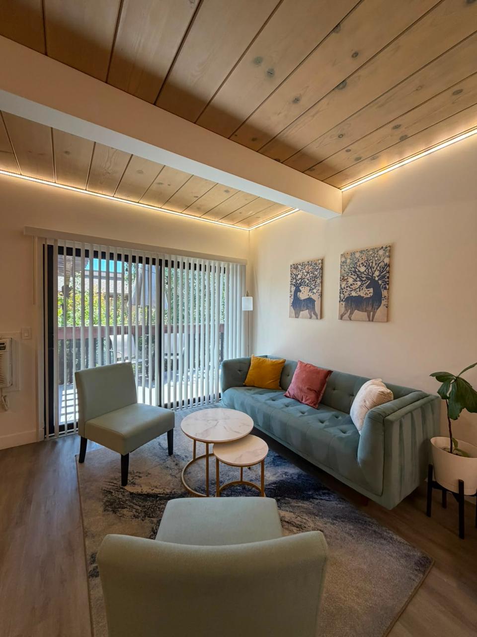 Tidy lounge area with sofa and chairs