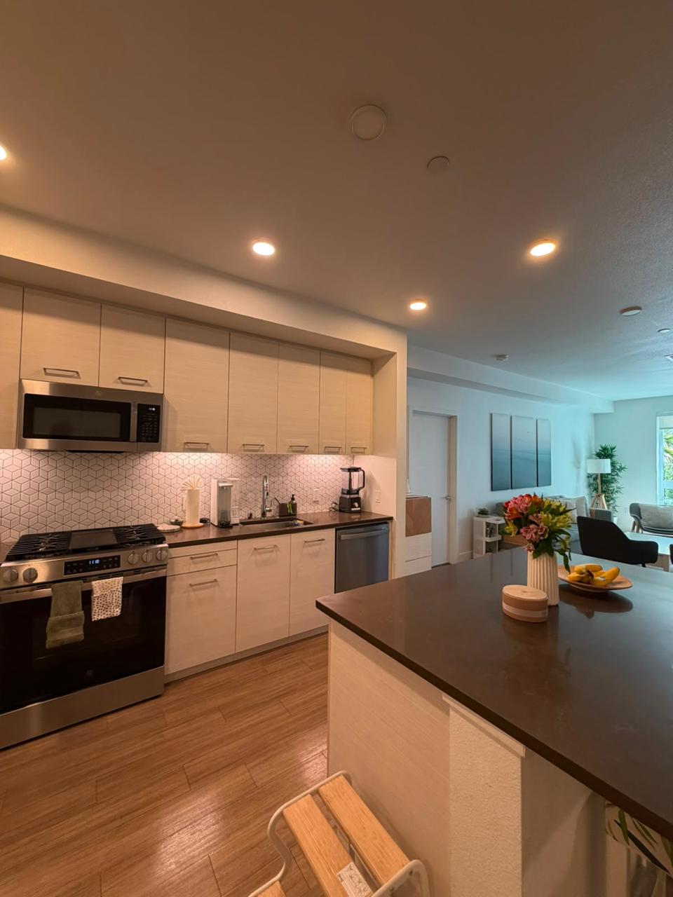 Bright kitchen with clean counters and stainless appliances