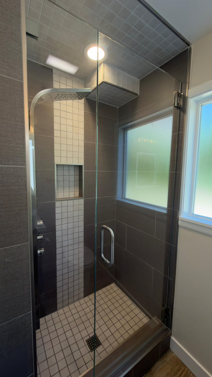 Detailed tiled shower cleaned after construction work